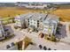 An aerial view of modern multi-Gathering building showcasing its architectural details and parking at 7517 Laureate Blvd # 4206, Orlando, FL 32827
