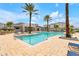 Stunning community pool with ample seating and lush landscaping, creating a resort-like atmosphere at 7517 Laureate Blvd # 4206, Orlando, FL 32827
