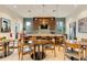 Modern dining area with long island, ample bar stool seating, and stainless steel refrigerator at 7517 Laureate Blvd # 4206, Orlando, FL 32827