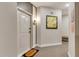 Hallway view features a welcome mat, unit number 4206, and stylish artwork at 7517 Laureate Blvd # 4206, Orlando, FL 32827