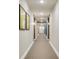 An elegant hallway features plush carpeting, warm lighting, and stylish artwork at 7517 Laureate Blvd # 4206, Orlando, FL 32827