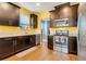Bright kitchen with stainless steel appliances, undermount sink, and dark wood cabinets at 7517 Laureate Blvd # 4206, Orlando, FL 32827