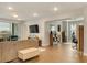 Open living room with wood floors, bright windows, and sliding doors to a patio at 7517 Laureate Blvd # 4206, Orlando, FL 32827