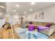 Comfortable living room is spacious and bright, with an adjacent bathroom at 7517 Laureate Blvd # 4206, Orlando, FL 32827