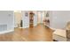 Spacious open floor plan with wood flooring and easy access to bathroom and entryway at 7517 Laureate Blvd # 4206, Orlando, FL 32827