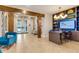 Bright lobby area with tiled floors and ample seating at 7517 Laureate Blvd # 4206, Orlando, FL 32827
