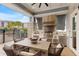 Covered outdoor kitchen and dining area with built-in grill at 7517 Laureate Blvd # 4206, Orlando, FL 32827
