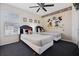 Bedroom featuring cartoon-themed wallpaper, two twin beds, a ceiling fan, and closet at 7902 Silver Bass Ct, Kissimmee, FL 34747