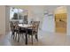 This formal dining room features seating for six, a large window, and access to the kitchen at 7902 Silver Bass Ct, Kissimmee, FL 34747