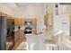 Modern kitchen features stainless steel appliances, granite countertops, and bar seating at 7902 Silver Bass Ct, Kissimmee, FL 34747