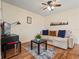 Cozy living room with ceiling fan, modern decor, and wood-look flooring at 819 Veranda Pl, Celebration, FL 34747