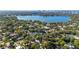 Beautiful aerial view showcasing a lakefront community with lush landscaping and luxury homes near the city skyline at 8508 Alveron Ave # 1, Orlando, FL 32817