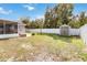 Spacious backyard features a shed, a full fence, and a fire pit at 8508 Alveron Ave # 1, Orlando, FL 32817