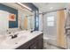 Bright bathroom featuring double sinks, subway tile, and a shower-tub combination at 8508 Alveron Ave # 1, Orlando, FL 32817