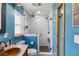 Bright bathroom featuring tiled shower with glass door, and bronze fixtures at 8508 Alveron Ave # 1, Orlando, FL 32817