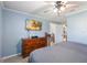 Comfortable bedroom with a ceiling fan, a flat screen TV and view to an adjacent room at 8508 Alveron Ave # 1, Orlando, FL 32817