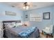 Comfortable bedroom with a ceiling fan, a queen-sized bed, and a side chair by a window at 8508 Alveron Ave # 1, Orlando, FL 32817