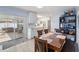 Cozy dining room featuring a wooden table, seating, and sliding glass doors to the outdoor patio at 8508 Alveron Ave # 1, Orlando, FL 32817