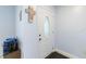 This well-lit entryway features a decorative front door and light-blue walls at 8508 Alveron Ave # 1, Orlando, FL 32817