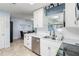 Bright kitchen featuring white cabinets, stainless steel appliances, and tile flooring at 8508 Alveron Ave # 1, Orlando, FL 32817