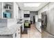 Updated kitchen showcasing white cabinets, stainless steel appliances, and ample counter space at 8508 Alveron Ave # 1, Orlando, FL 32817