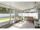 Enclosed patio features outdoor seating and direct access to backyard and a shed at 8508 Alveron Ave # 1, Orlando, FL 32817