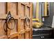 Ornate door to a uniquely designed bathroom featuring a gold sink and black fixtures at 8929 Legacy Ct # 106, Kissimmee, FL 34747