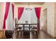 Dining Room with dramatic floor to ceiling window treatments, and seating for four at 8929 Legacy Ct # 106, Kissimmee, FL 34747