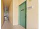 Building entrance featuring a green door with a 'Hogwarts' sign at 8929 Legacy Ct # 106, Kissimmee, FL 34747