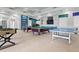 Spacious game room offering pool tables, ping pong, foosball and a wall-mounted TV at 8929 Legacy Ct # 106, Kissimmee, FL 34747