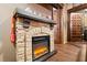 Stone fireplace and hearth with a wood mantle is the focal point of this room at 8929 Legacy Ct # 106, Kissimmee, FL 34747