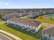 New community offering multiple townhomes and single-Gathering homes with lush lawns and scenic pond views at 925 Conch Rd, Davenport, FL 33896