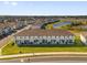 Newly constructed community of townhomes and single-Gathering homes featuring a beautiful pond at 925 Conch Rd, Davenport, FL 33896