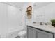 Bright bathroom with tub/shower combo and modern vanity at 925 Conch Rd, Davenport, FL 33896