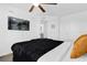 Cozy bedroom with a large TV, comfortable bed, and a serene atmosphere at 925 Conch Rd, Davenport, FL 33896