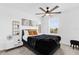 Stylish bedroom featuring modern decor, a large window, and ample natural light at 925 Conch Rd, Davenport, FL 33896