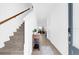 Inviting entryway featuring tile floors, staircase, and view into the open-concept living spaces at 925 Conch Rd, Davenport, FL 33896