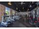 Well-equipped fitness center with treadmills, weights, and exposed brick offering a stylish workout space at 925 Conch Rd, Davenport, FL 33896