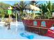 Whimsical splash pad featuring a pirate ship with water cannons and a dolphin fountain for Gathering fun at 925 Conch Rd, Davenport, FL 33896