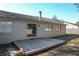 Home exterior with a wooden deck perfect for outdoor entertaining with a sliding glass door entry at 103 N Atlas Dr, Apopka, FL 32703