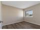 Bedroom featuring neutral walls, new floors, and window at 103 N Atlas Dr, Apopka, FL 32703