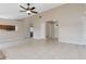 Bright and airy living room featuring tiled flooring, a ceiling fan, and open access to other areas of the house at 103 N Atlas Dr, Apopka, FL 32703