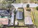 Aerial view of a home with a fenced yard and detached shed at 109 Mcquigg Ave, Orlando, FL 32805