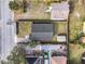 Birds eye view of a house with a fenced yard, shed and a paved driveway at 109 Mcquigg Ave, Orlando, FL 32805