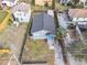 Aerial view of gray roof, fenced in yard, and front porch at 109 Mcquigg Ave, Orlando, FL 32805