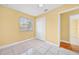 Bedroom featuring tiled floors, ceiling fan, and a closet with sliding doors at 109 Mcquigg Ave, Orlando, FL 32805