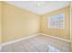 Bedroom featuring tiled floors, ceiling fan, and a single window with blinds at 109 Mcquigg Ave, Orlando, FL 32805