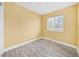 Cozy bedroom with hardwood floors and natural light from the window at 109 Mcquigg Ave, Orlando, FL 32805