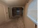 Neutral bedroom featuring carpet floors, closet doors, and natural light through the window at 110 Kasey Dr, Orlando, FL 32807