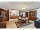 Dining room with built-in display cabinets and wood flooring at 1101 N Valencia Ave, Howey In The Hills, FL 34737